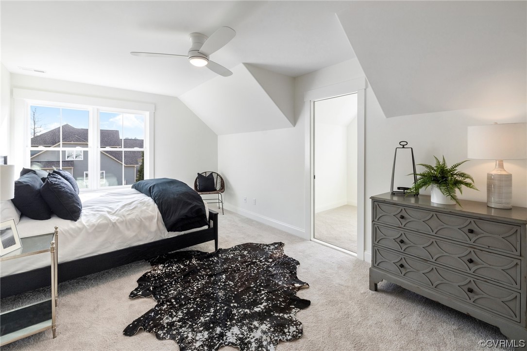 5143 Lake Summer Loop Moseley, VA 23120 - Photo 42 of 49 a bedroom with a bed a dresser with wooden floor