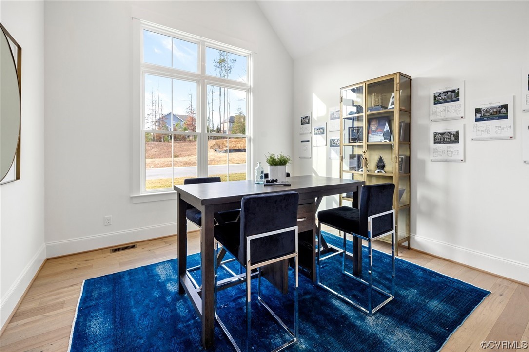 5143 Lake Summer Loop Moseley, VA 23120 - Photo 7 of 49 a view of a dining room with furniture window and wooden floor