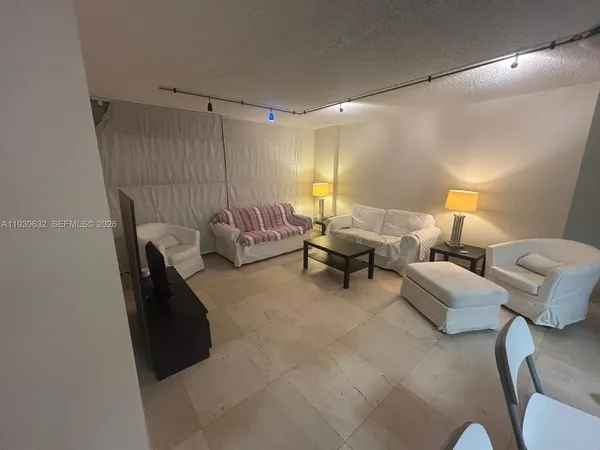 a bed room with furniture and a lamp