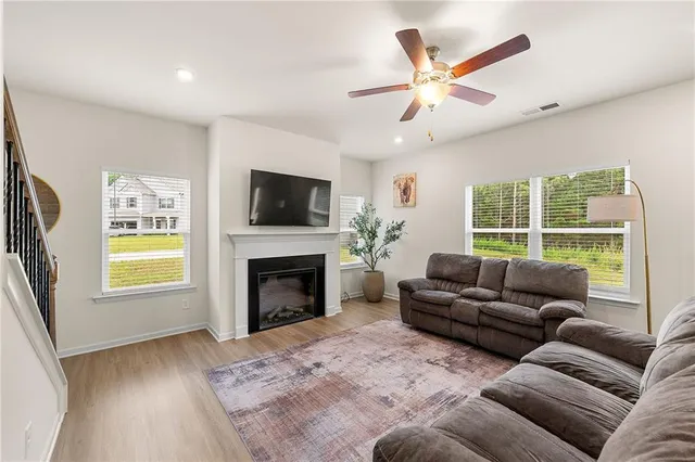 a living room with furniture window and a fireplace