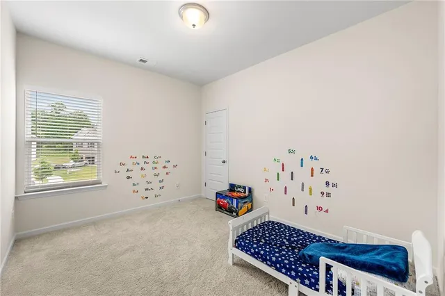 a bedroom with furniture and a window