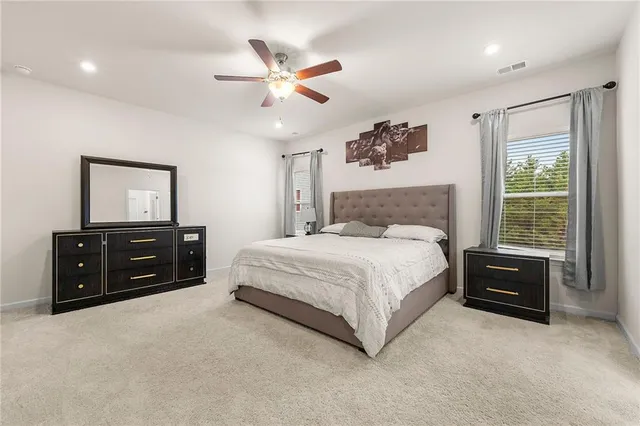 a bed room with a bed and a tv