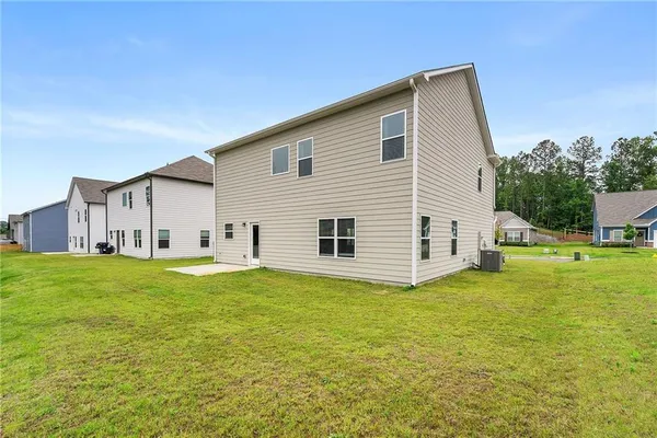 a view of a house with backyard porch and garden