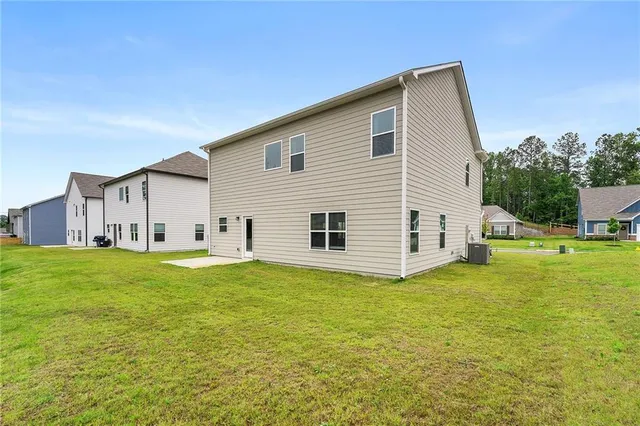 a view of a house with backyard porch and garden