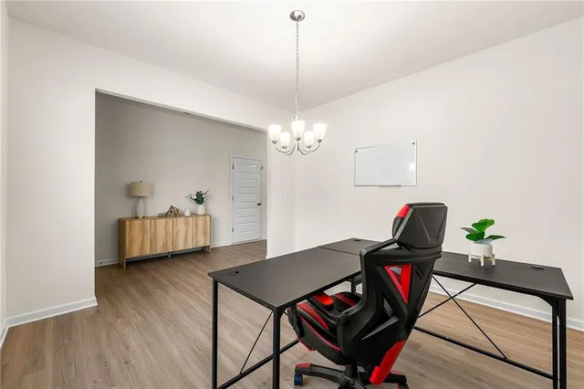 a workspace with furniture and wooden floor