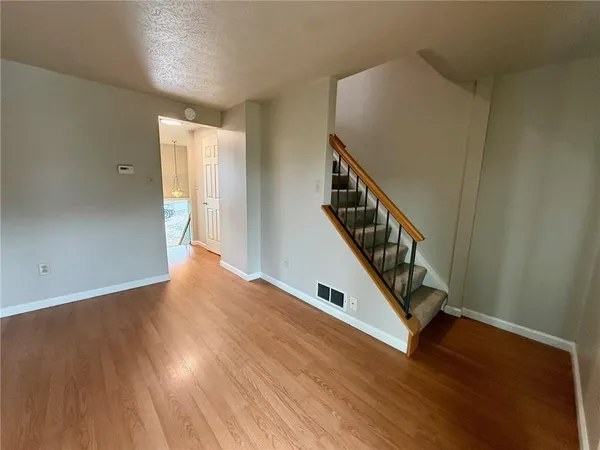 a view of entryway with wooden floor