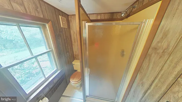 a bathroom with a shower and a tub