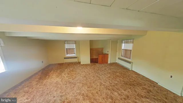 a view of an empty room and window