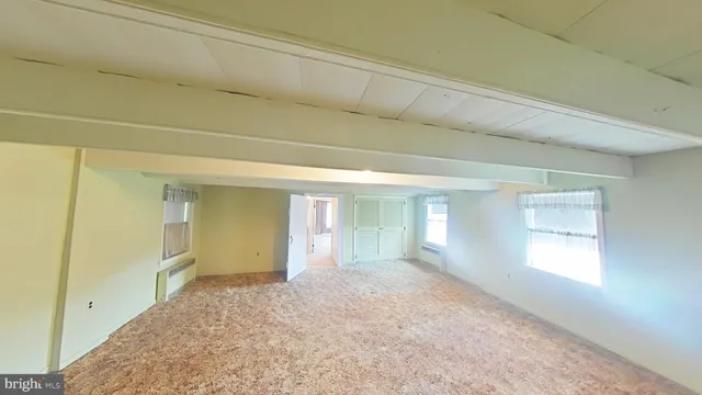 a view of an empty room and window