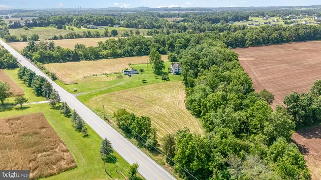 an aerial view of lake and mountain