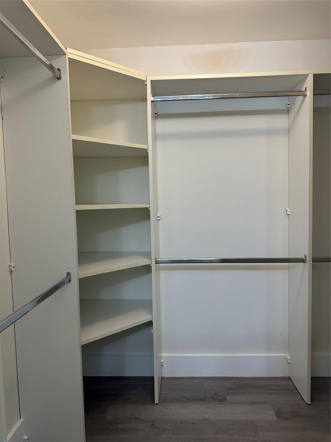 159 Northwest 70th Street, Unit 517 Boca Raton, FL 33487 - Photo 20 of 30 a view of walk in closet with empty racks