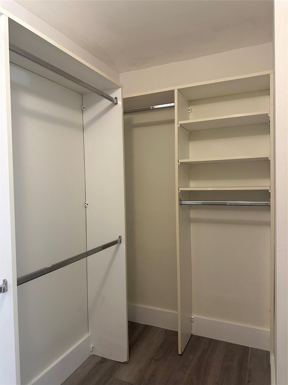 159 Northwest 70th Street, Unit 517 Boca Raton, FL 33487 - Photo 22 of 30 a view of walk in closet with empty racks