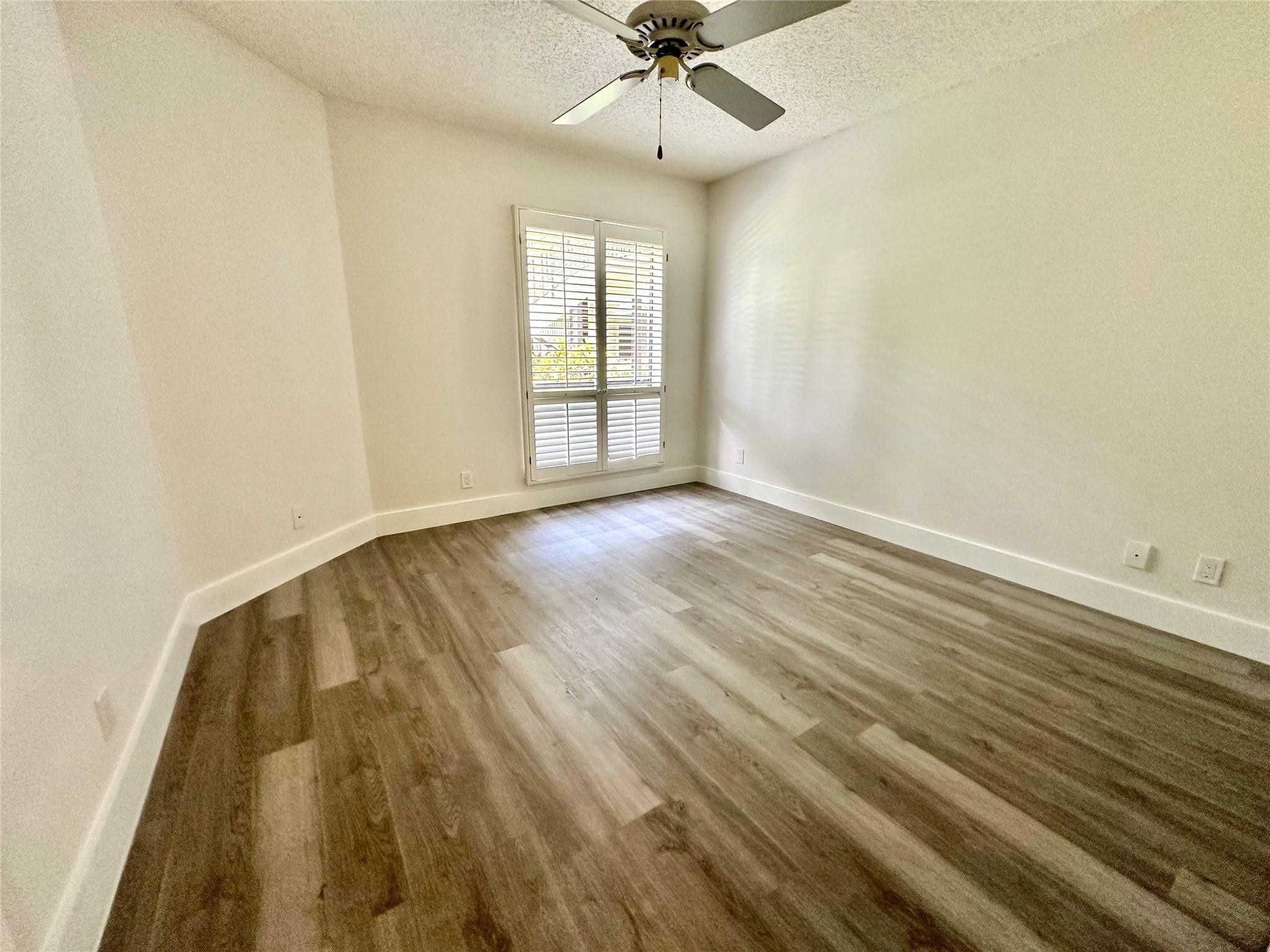 159 Northwest 70th Street, Unit 517 Boca Raton, FL 33487 - Photo 23 of 30 wooden floor in an empty room