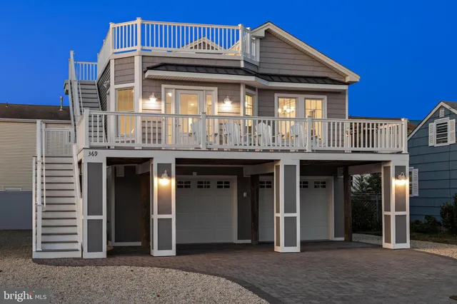 a living room with furniture a fireplace and a window