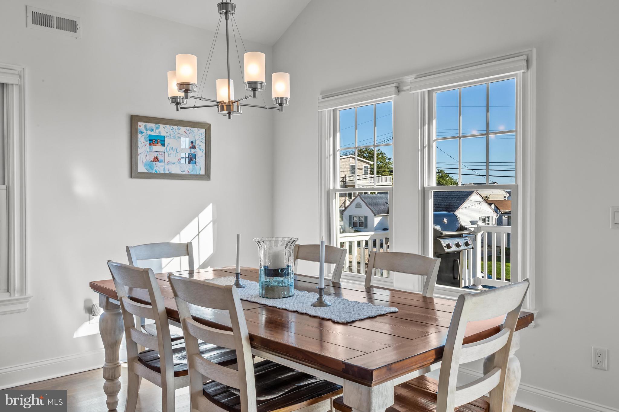 369 West 10th Street Ship Bottom, NJ 08008 - Photo 13 of 110 a dining room with furniture a chandelier and window
