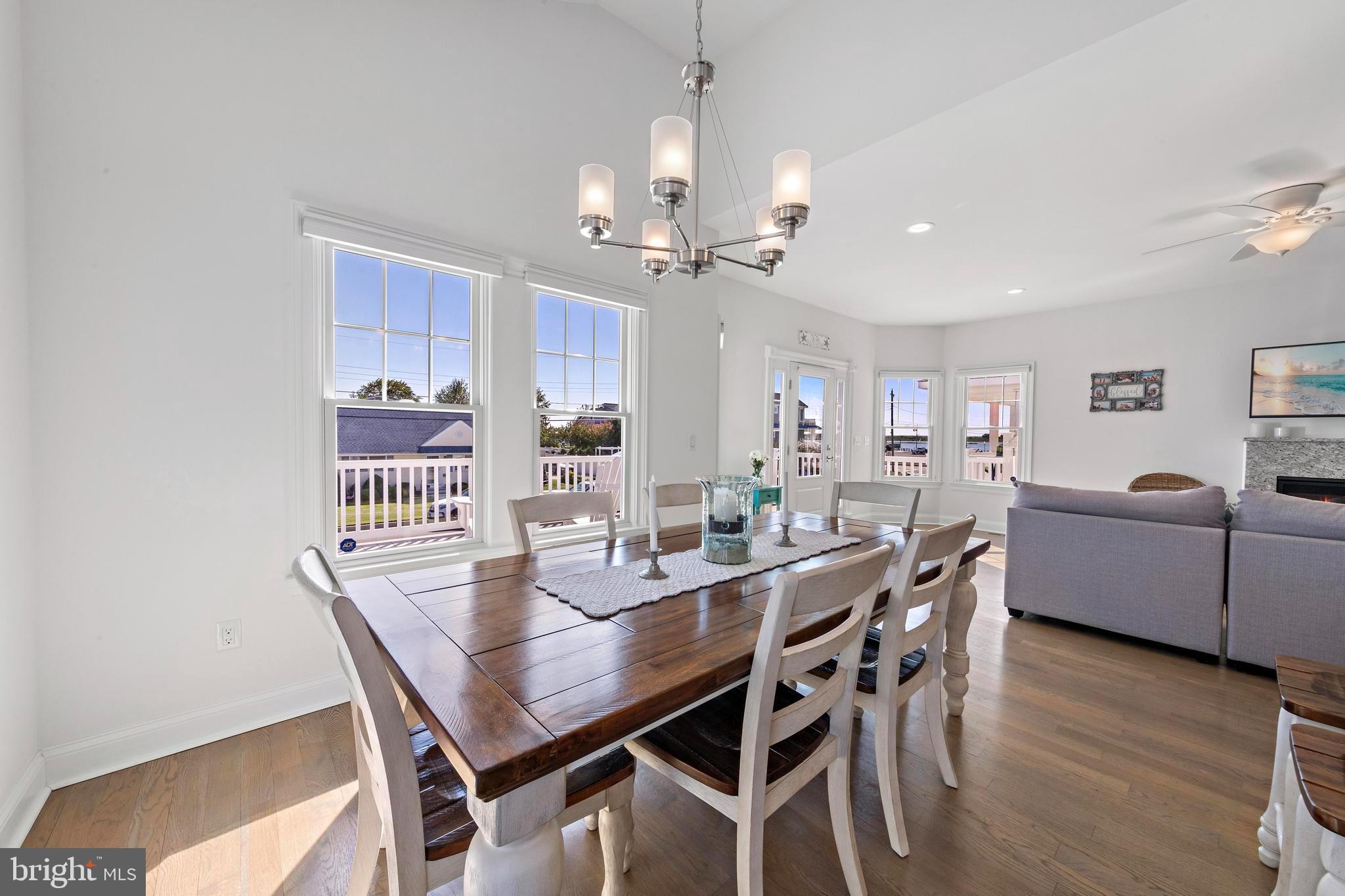 369 West 10th Street Ship Bottom, NJ 08008 - Photo 14 of 110 a view of a dining room with furniture and wooden floor