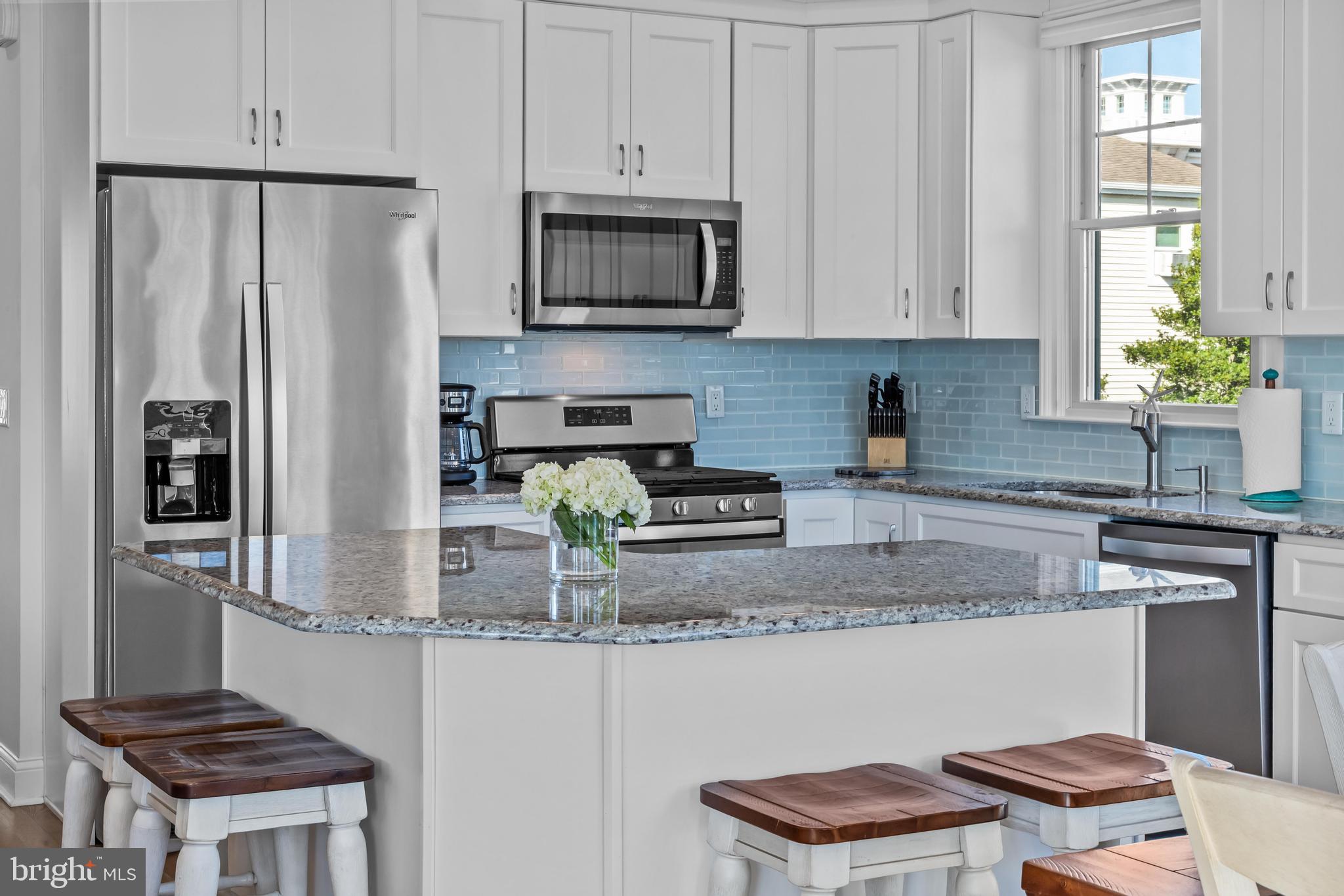 369 West 10th Street Ship Bottom, NJ 08008 - Photo 21 of 110 a kitchen with stainless steel appliances granite countertop a refrigerator a stove a sink and a white cabinets