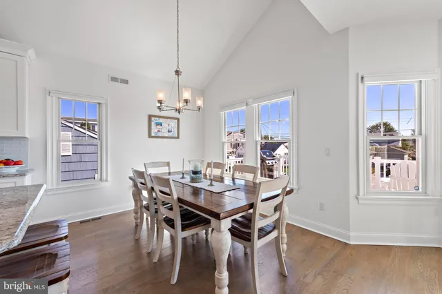 a kitchen with stainless steel appliances granite countertop a stove a refrigerator and a microwave