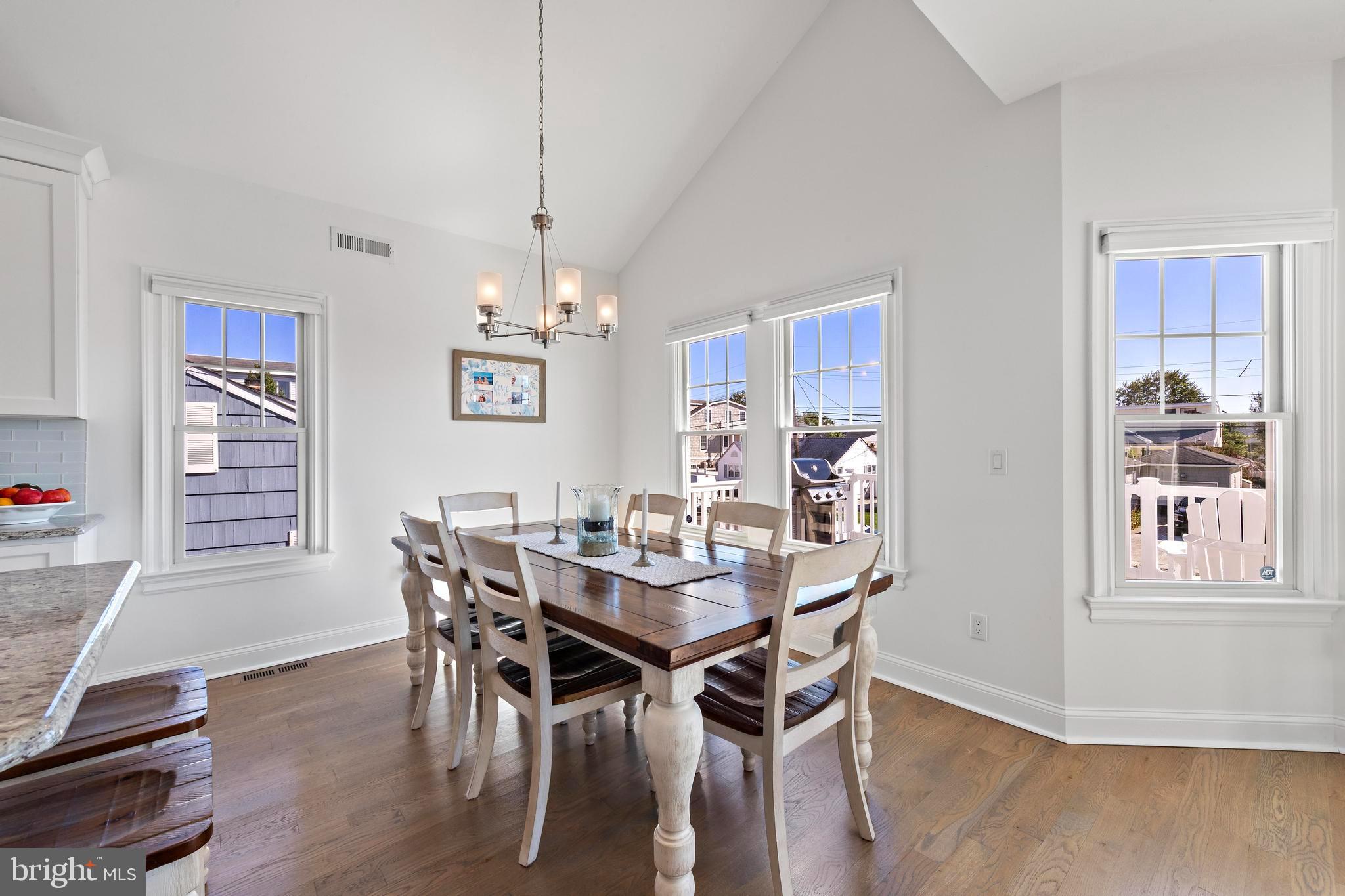 369 West 10th Street Ship Bottom, NJ 08008 - Photo 23 of 110 a view of a dining room with furniture window and wooden floor
