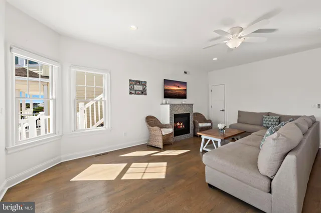 a kitchen with granite countertop white cabinets stainless steel appliances and a sink