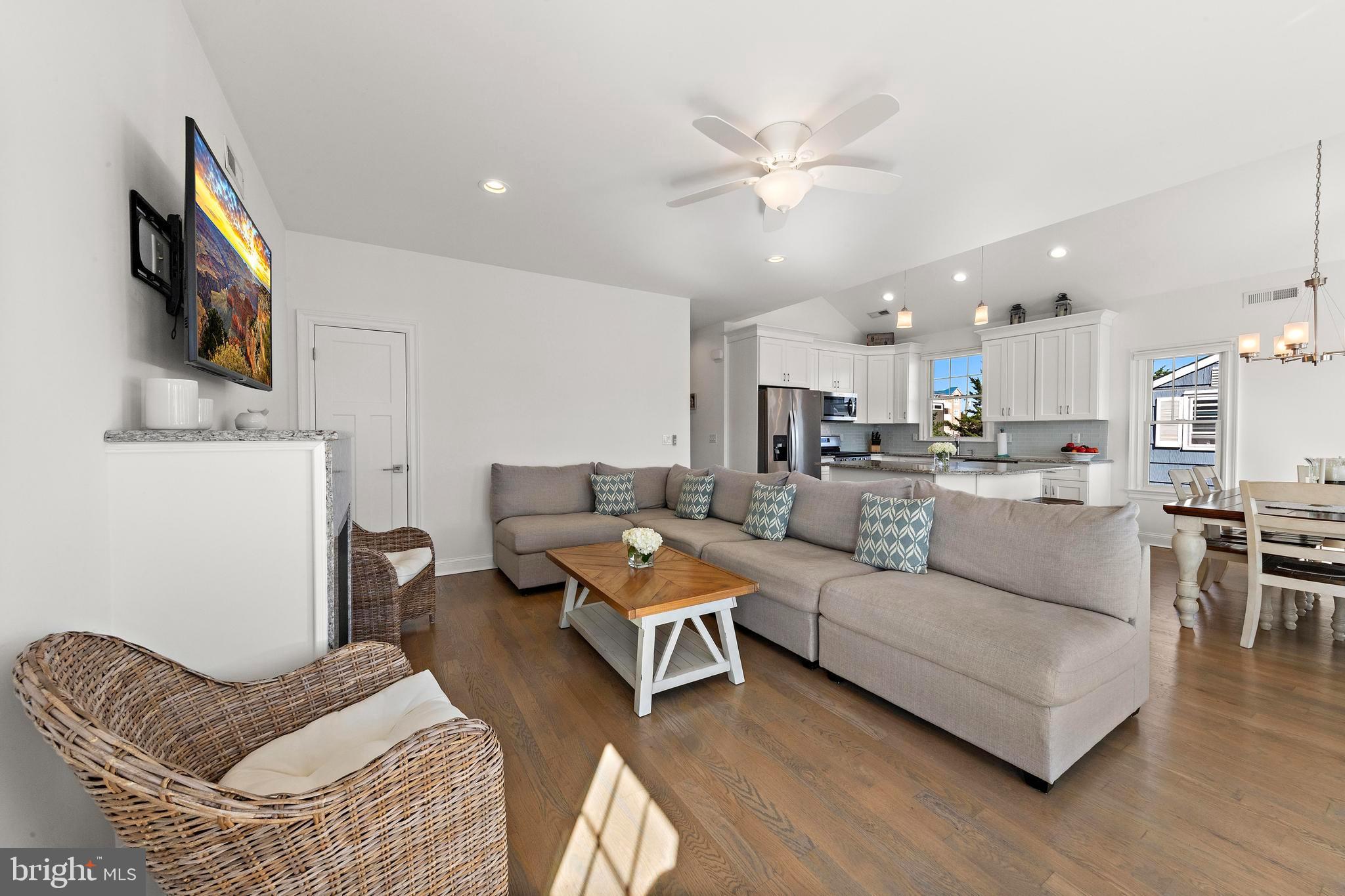 369 West 10th Street Ship Bottom, NJ 08008 - Photo 29 of 110 a living room with furniture kitchen view and a flat screen tv