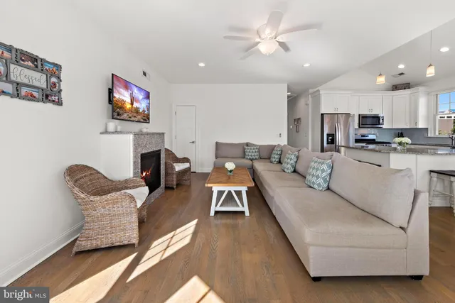 a bedroom with a bed and a ceiling fan