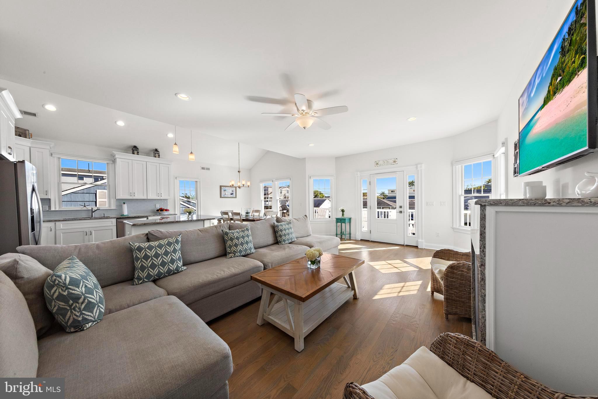 369 West 10th Street Ship Bottom, NJ 08008 - Photo 32 of 110 a living room with furniture and a flat screen tv