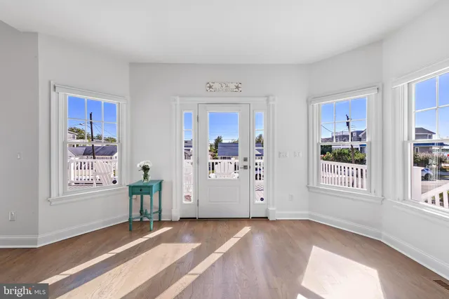 a view of a balcony with wooden floor and city view