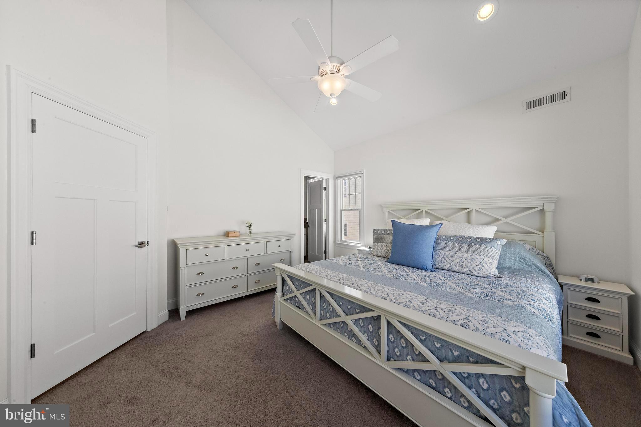 369 West 10th Street Ship Bottom, NJ 08008 - Photo 42 of 110 a large bedroom with a bed and a chandelier