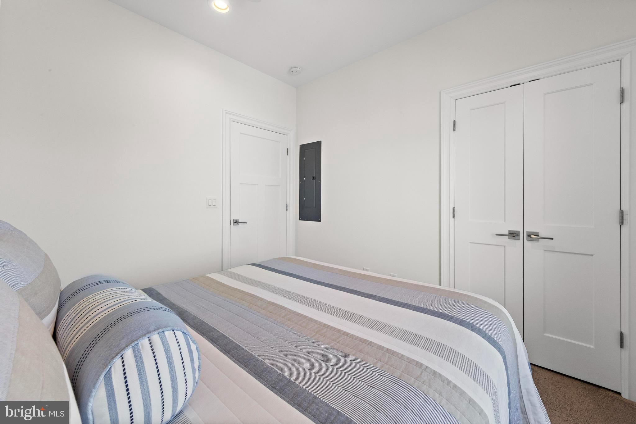 369 West 10th Street Ship Bottom, NJ 08008 - Photo 46 of 110 a bedroom with a bed and a closet