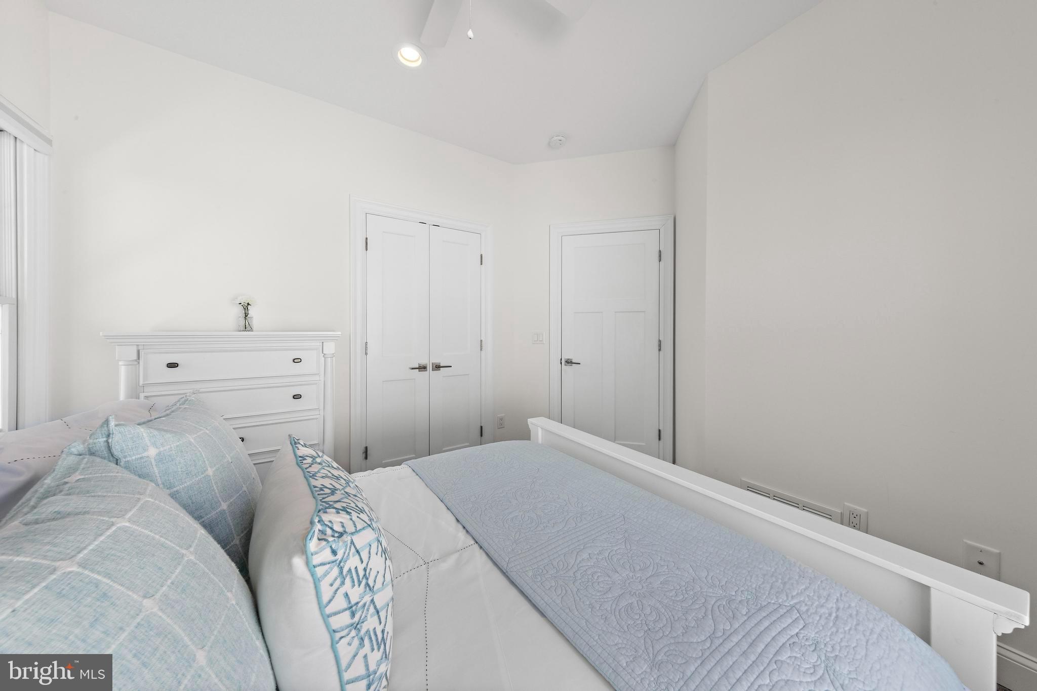 369 West 10th Street Ship Bottom, NJ 08008 - Photo 48 of 110 a bedroom with a bed and cabinet