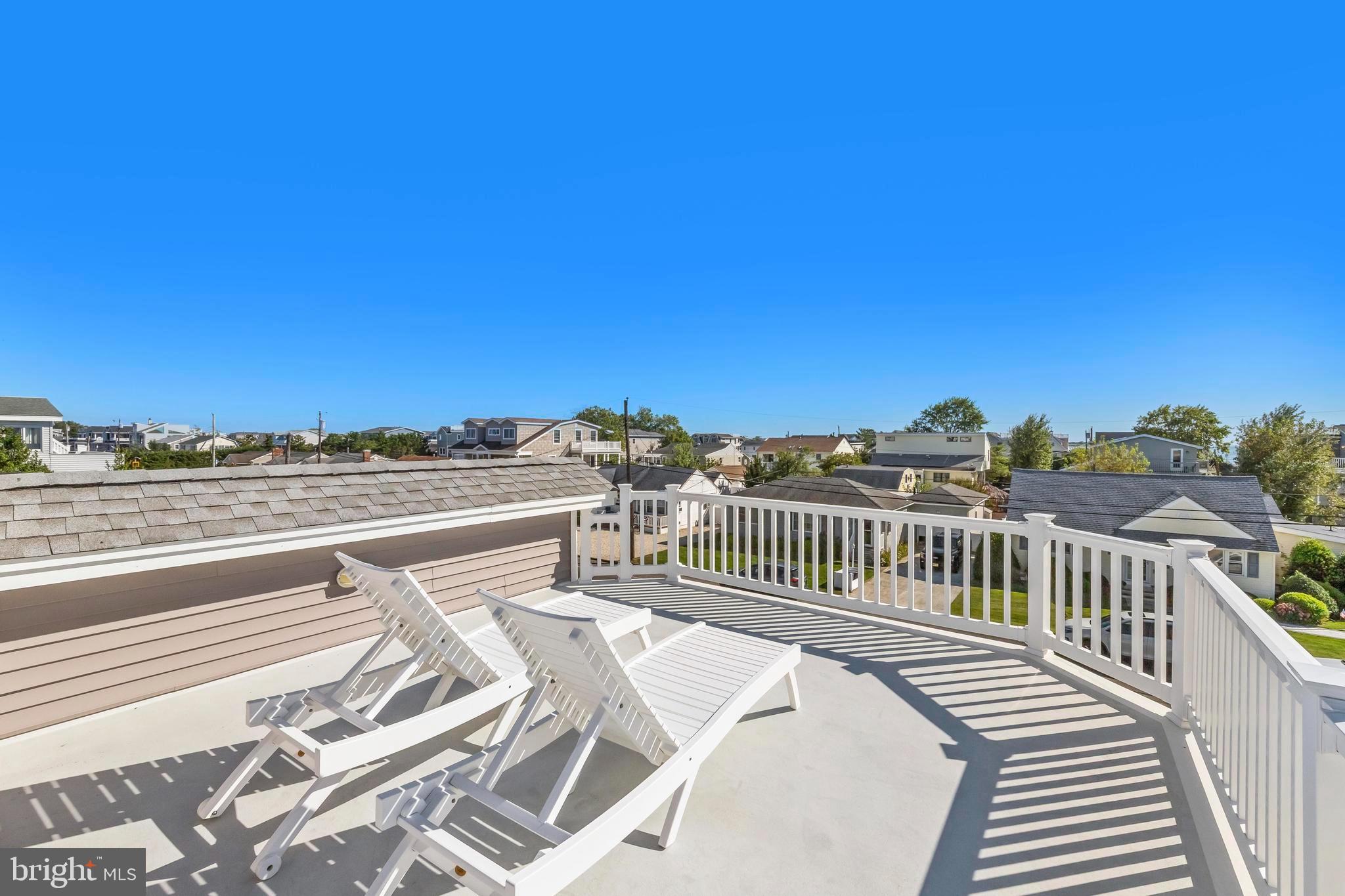 369 West 10th Street Ship Bottom, NJ 08008 - Photo 56 of 110 a view of a balcony with wooden floor and city view