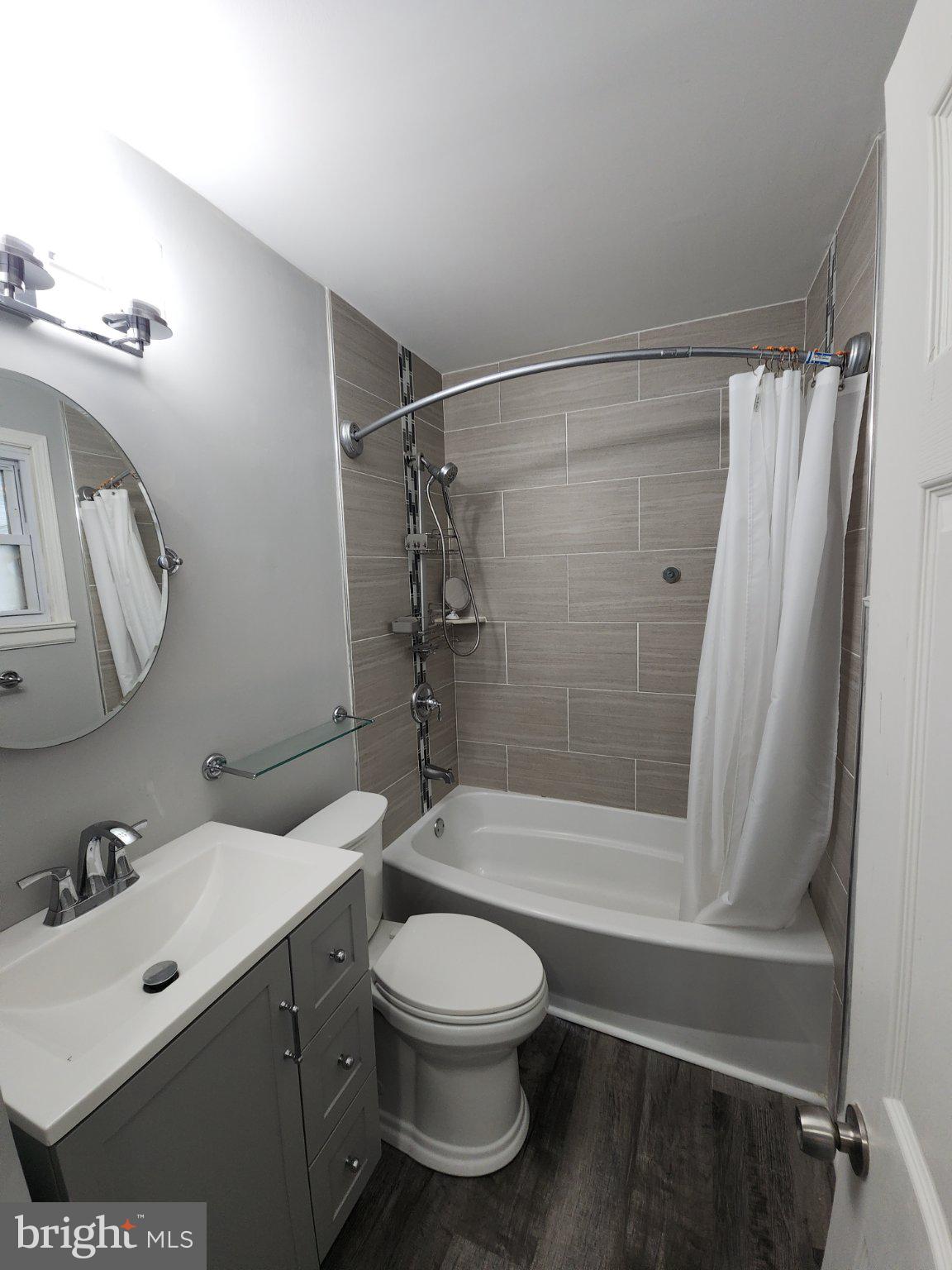 802 Devon Road Riverside, NJ 08075 - Photo 8 of 29 a bathroom with a sink a toilet and shower