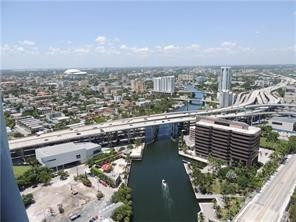 an aerial view of city and lake