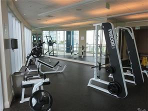 185 Southwest 7th Street, Unit 3507 Miami, FL 33130 - Photo 15 of 19 a view of a room with gym equipment