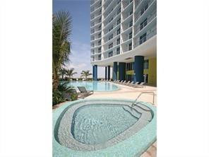 185 Southwest 7th Street, Unit 3507 Miami, FL 33130 - Photo 17 of 19 a view of a living room with a rug and a fountain