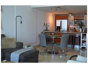 185 Southwest 7th Street, Unit 3507 Miami, FL 33130 - Photo 2 of 19 a view of a dining room with furniture