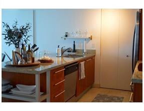 185 Southwest 7th Street, Unit 3507 Miami, FL 33130 - Photo 3 of 19 a kitchen with a sink and cabinets