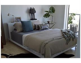 185 Southwest 7th Street, Unit 3507 Miami, FL 33130 - Photo 7 of 19 a bedroom with bed and potted plant