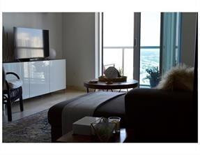 185 Southwest 7th Street, Unit 3507 Miami, FL 33130 - Photo 8 of 19 a living room with furniture and a flat screen tv