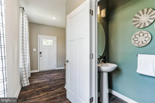 a view of bathroom with a table and a shower