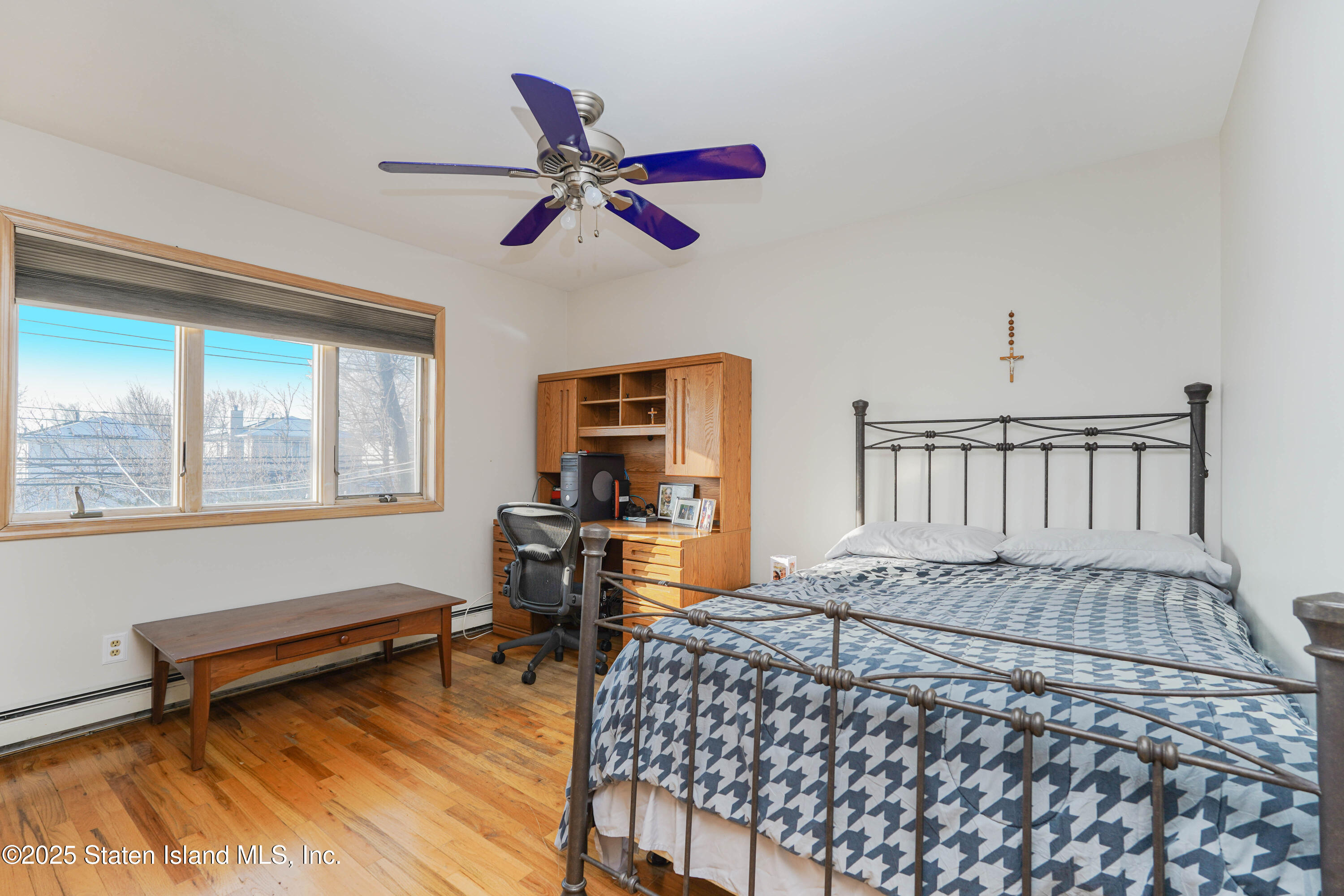 1527 Woodrow Road Staten Island, NY 10309 - Photo 18 of 37 a bedroom with furniture and a window