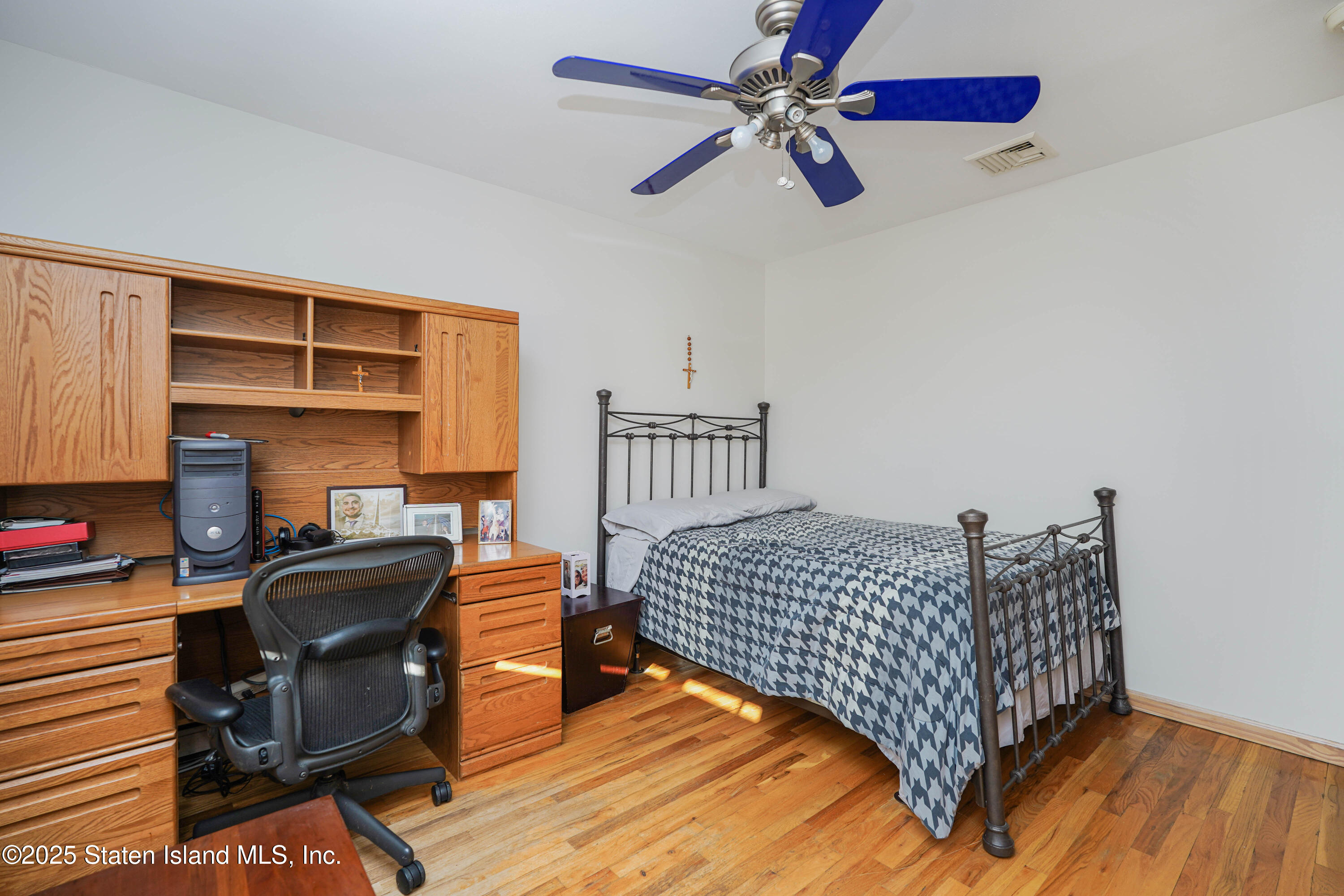 1527 Woodrow Road Staten Island, NY 10309 - Photo 19 of 37 a bedroom with furniture and a window
