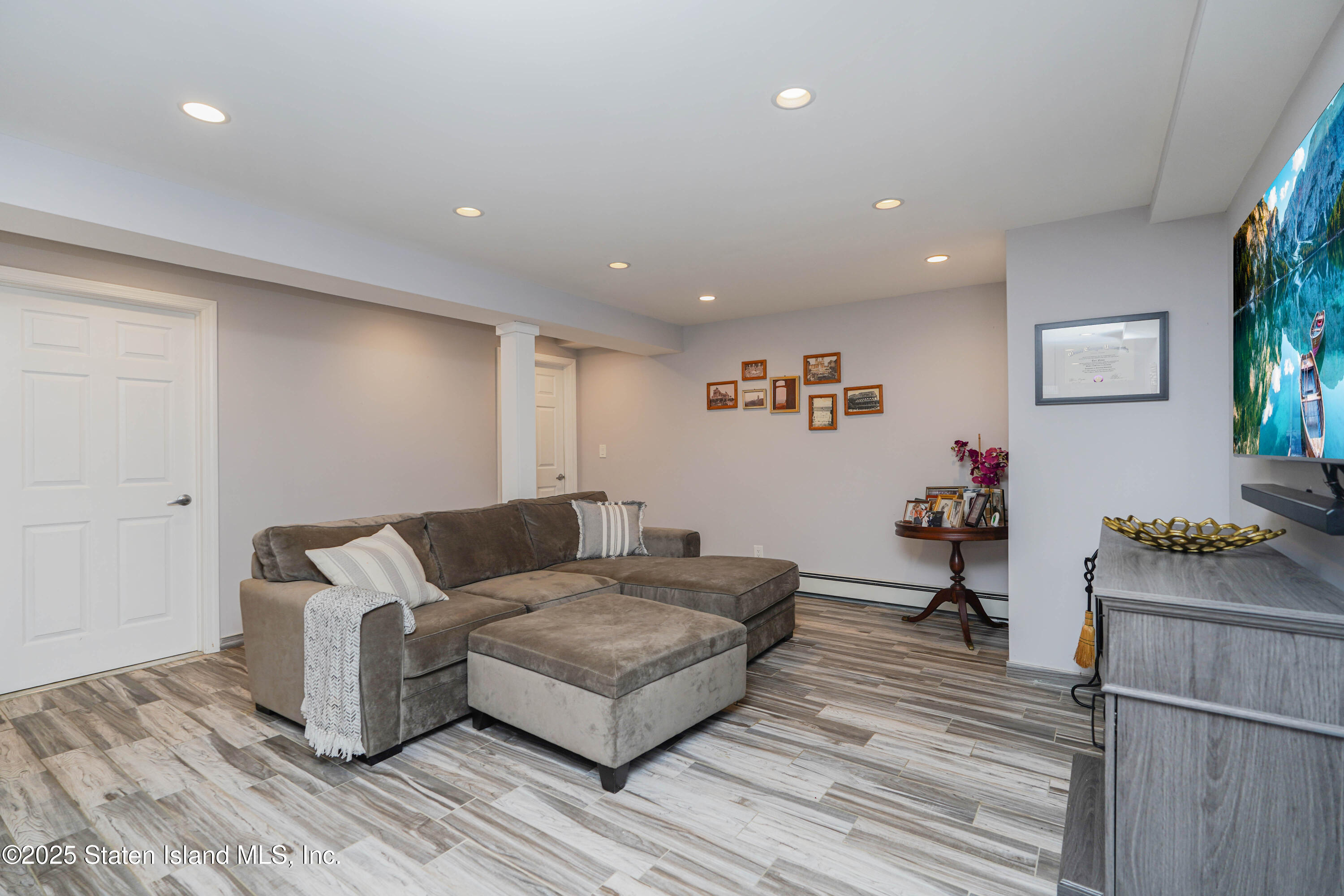 1527 Woodrow Road Staten Island, NY 10309 - Photo 30 of 37 a living room with furniture and a wooden floor