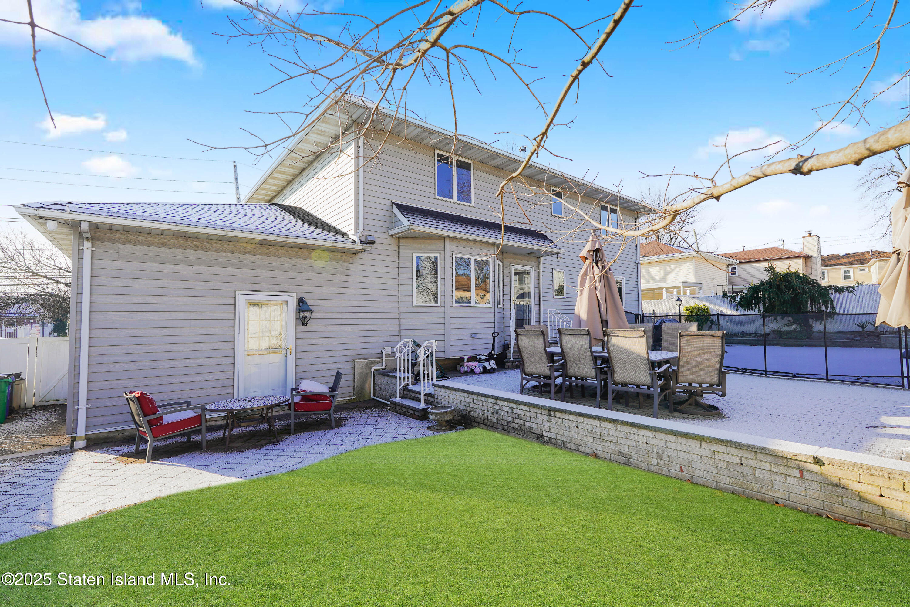 1527 Woodrow Road Staten Island, NY 10309 - Photo 34 of 37 a backyard of a house with seating space