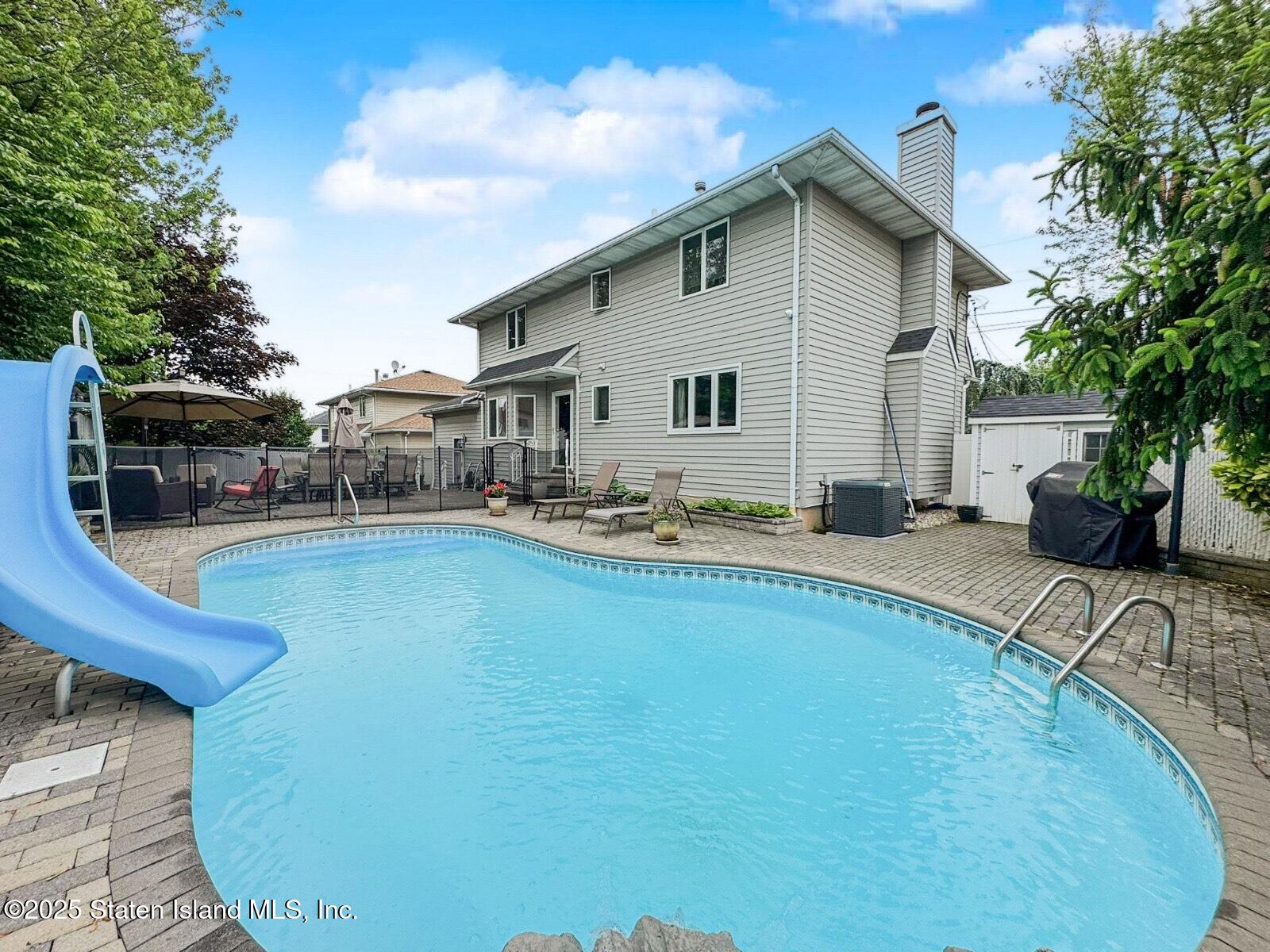1527 Woodrow Road Staten Island, NY 10309 - Photo 36 of 37 a swimming pool with outdoor seating yard and barbeque oven