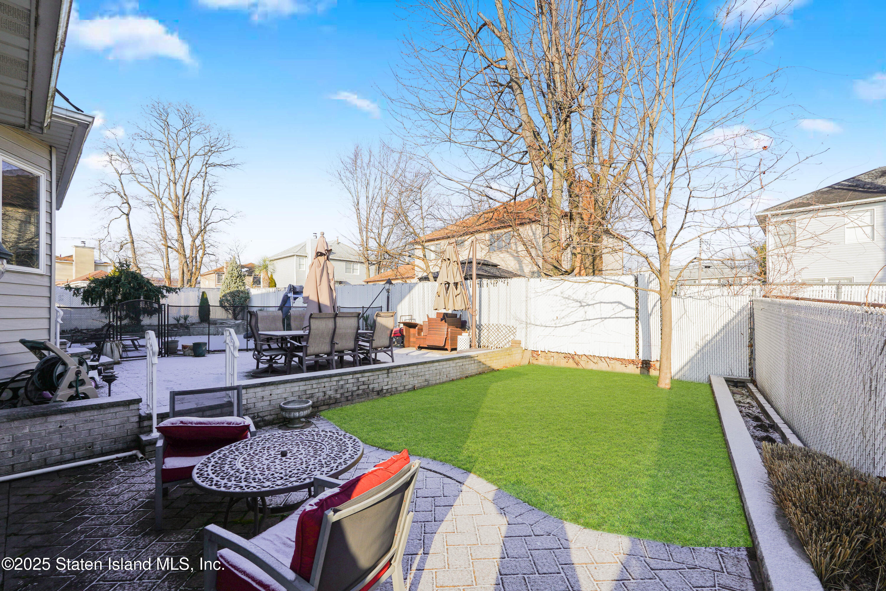 1527 Woodrow Road Staten Island, NY 10309 - Photo 37 of 37 a view of a backyard with sitting area