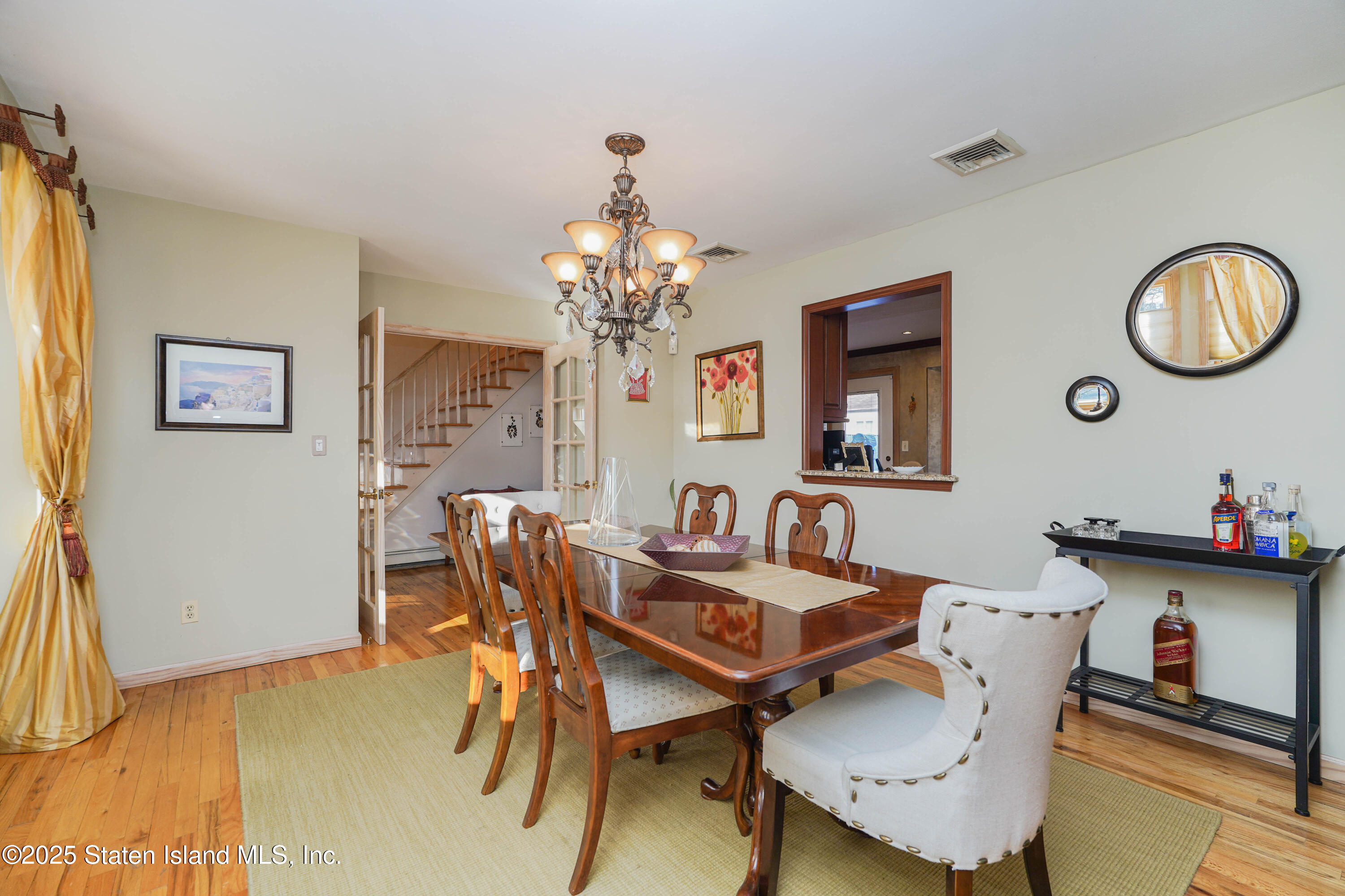 1527 Woodrow Road Staten Island, NY 10309 - Photo 10 of 37 a dining room with furniture and window