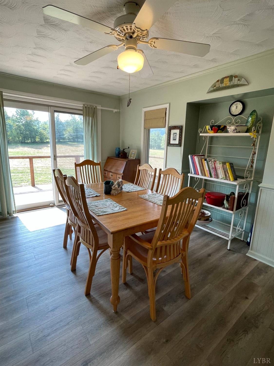 4063 Bore Auger Road Blue Ridge, VA 24064 - Photo 50 of 90 a view of a dining room with furniture wooden floor and chandelier