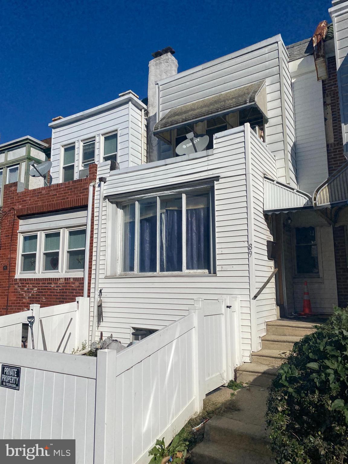 89 Lamport Road Upper Darby, PA 19082 - Photo 2 of 22 a front view of a house with a garage